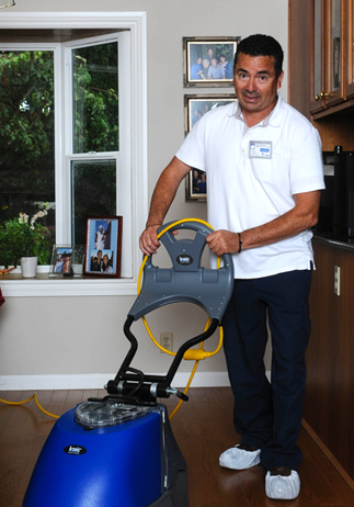 Victor Dominquez, cleaning hardwood wooden floors